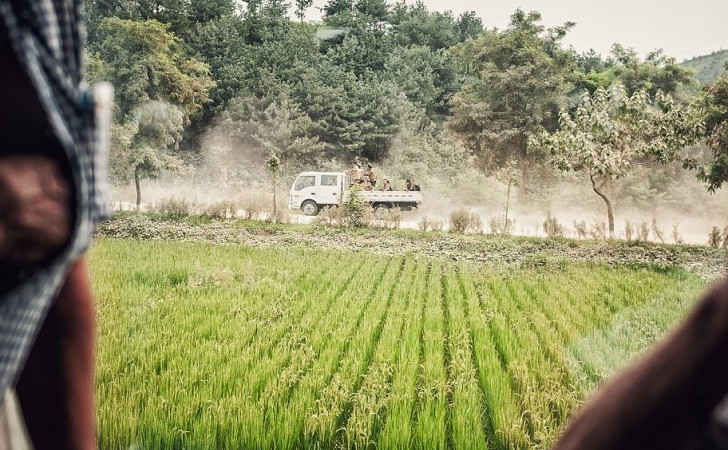 beatup truck hauling soldiers